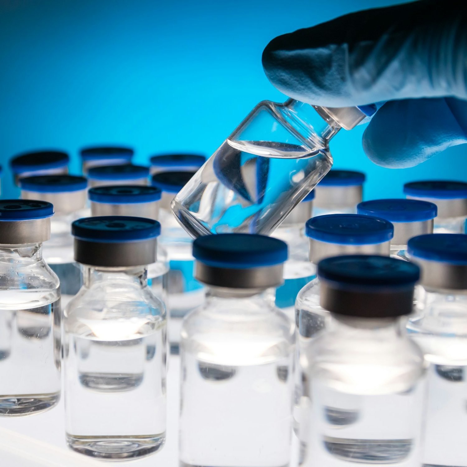 Group of Vaccine bottles. Medicine in ampoules. Glass vials for liquid samples in laboratory.